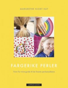 Omslaget til boka "Fargerike perler" av Margrethe Hjort Hay